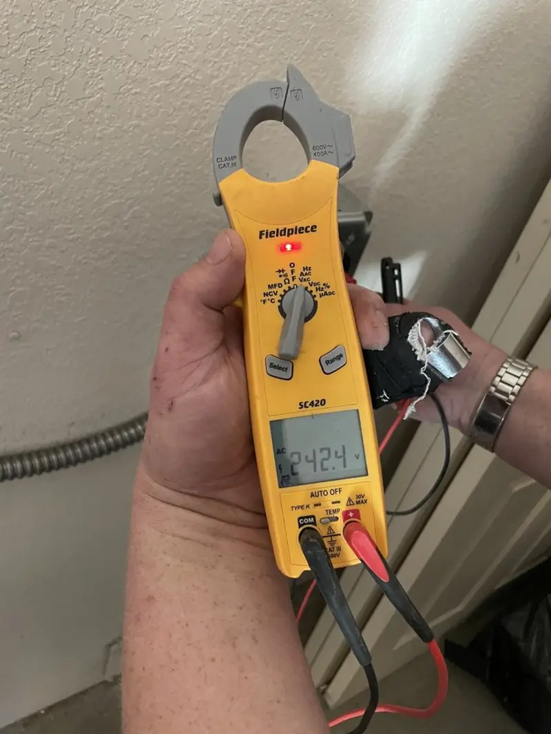 Voltage testing with clamp meter during Electrical Installation Services in Hockinson